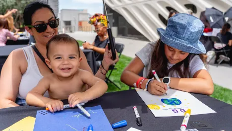 family making art at a table